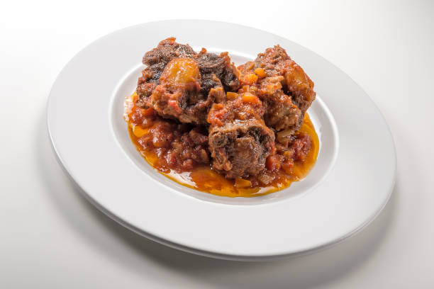istock Isolated Dish with a portion of oxtail stewed vaccinara 1154629115