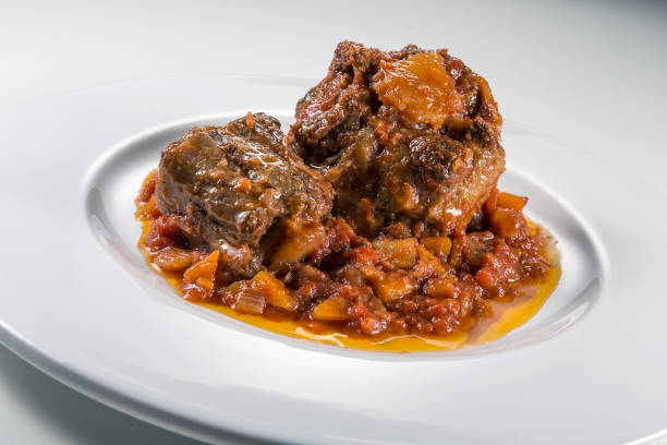 istock Isolated Dish with a portion of oxtail stewed vaccinara 1154629254