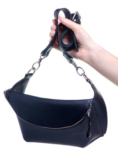 istock Black leather waist bag in hand 1154633147