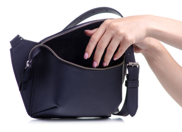 istock Black leather waist bag in hand 1154633154