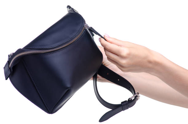 istock Black leather waist bag in hand 1154633198