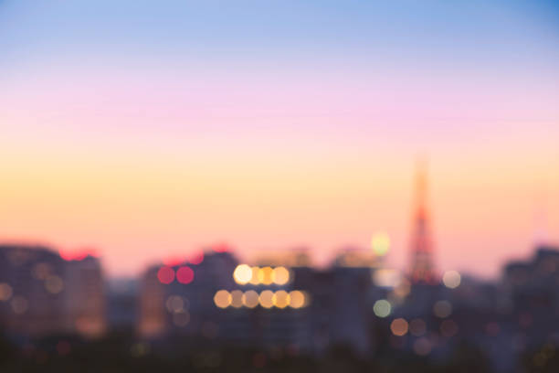 istock Abstract blur bokeh of night light city at sunset 1154638320