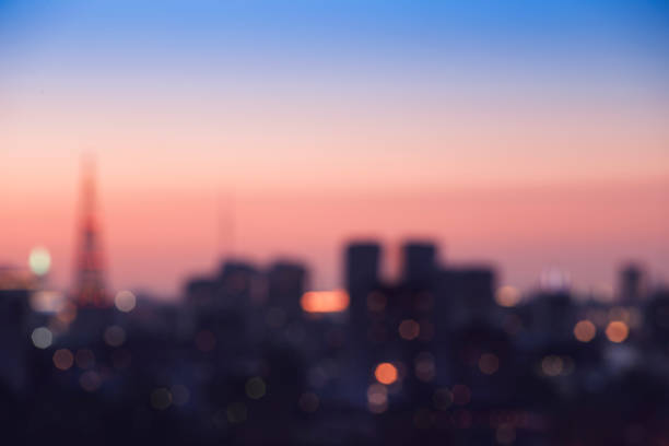 istock Abstract blur bokeh of night light city at sunset 1154638330