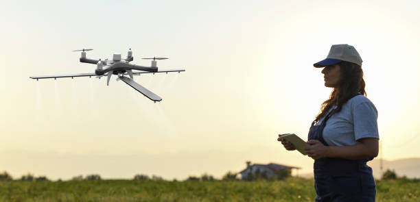 istock Young female farmer operating smart-farming drone 1154640788