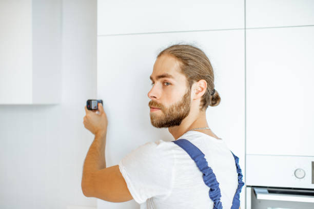 istock Man measuring distances at home 1154643269