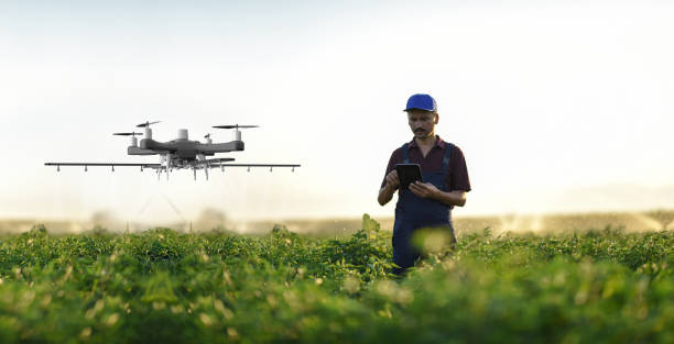 istock Farmer operating smart-farming drone 1154643289