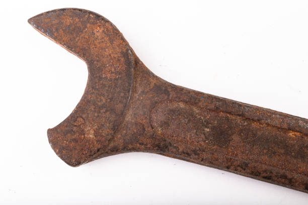 istock Old rusty damaged workshop key. Accessories for a mechanic from an old workshop. Light backg 1154647882