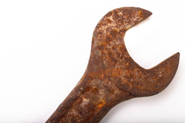 istock Old rusty damaged workshop key. Accessories for a mechanic from an old workshop. Light backg 1154648134