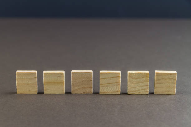 istock Six children wooden blocks in line 1154651185