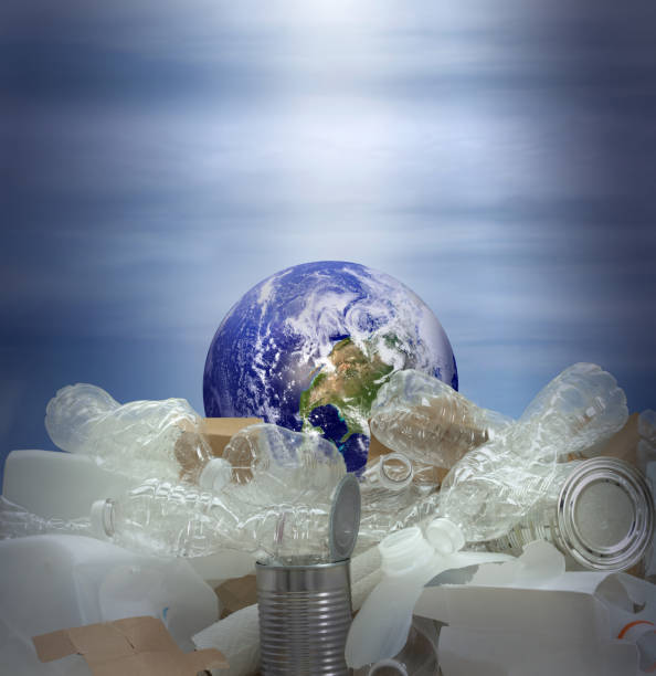 istock The Earth drowning in recyclable plastic and trash with storm background 1154651320