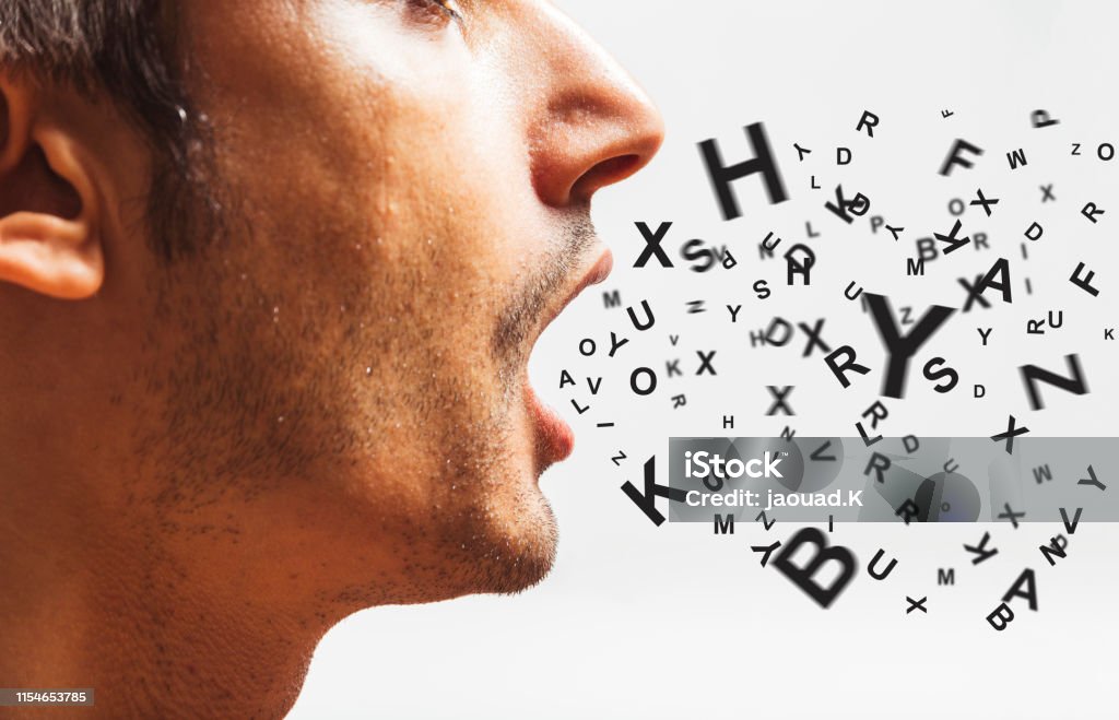 close up of a young man speaks - words power - watch your words concept Talking Stock Photo