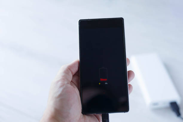 istock The phone is charging with Power bank 1154658306