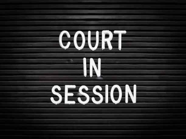 Legal Image Of A Retro Court In Session Sign At A Courthouse