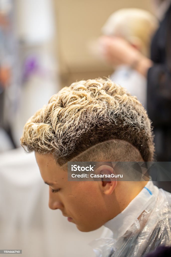 Late Teen Boy With New Hairstyle At Hair Salon Stock Photo - Download Image  Now - Men, Hair Treatment, Bleached Hair - iStock