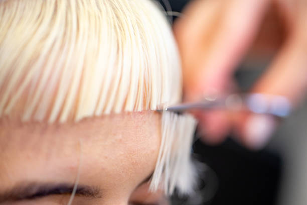 istock Close-up of Cutting Hair on Forehead 1154666773