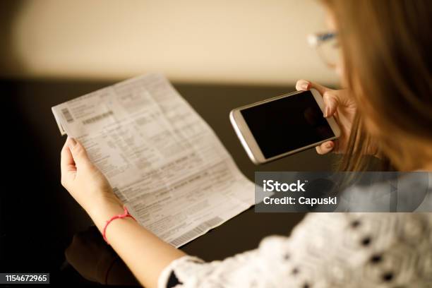 Woman Paying Bills With Phone Stock Photo - Download Image Now - Adult, Adults Only, Bar Code Reader