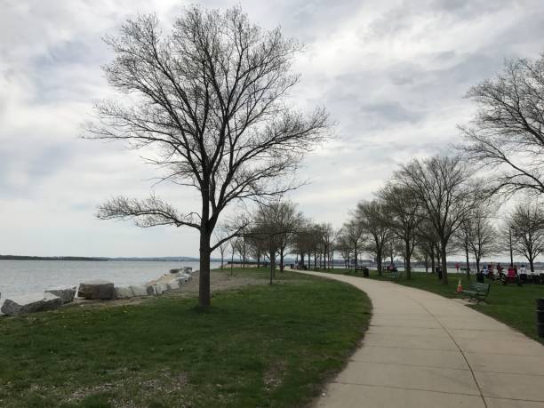istock Curving paved trail along the water 1154678157