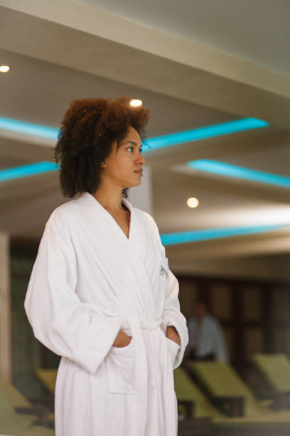 istock Beautiful young woman at spa resort 1154684313