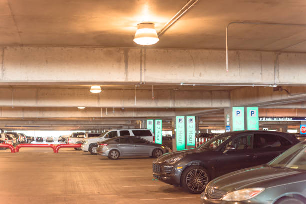 istock Overhead green or led indicators showing available parking spaces at modern garage 1154691808