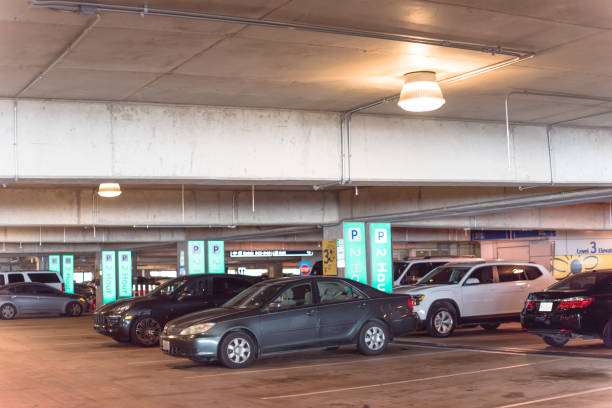 istock Overhead green or led indicators showing available parking spaces at modern garage 1154691869