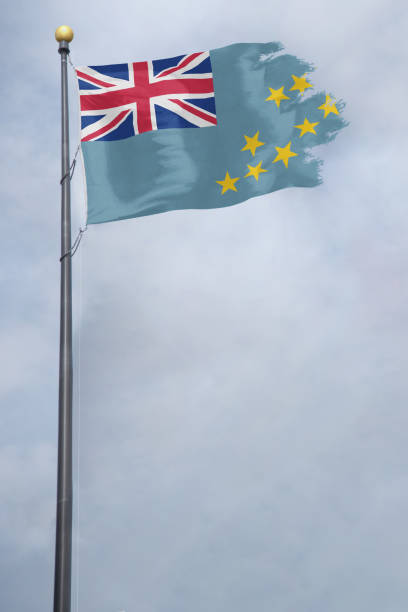 istock Tuvalu Flag with a torn edge in front of a stormy sky 1154693479