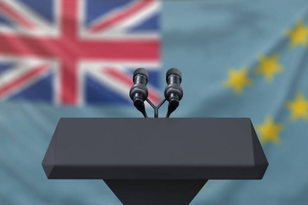 istock Tuvalu Flag at a press conference with microphones 1154693480