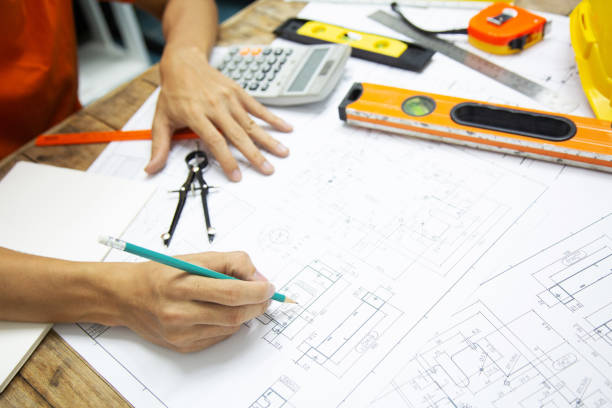 istock Architect Designing in blueprint at Construction Site With drawing equipment.concept 1154694333