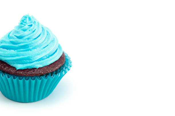istock Single Turquoise Iced Chocolate Cupcake Isolated on a White Background 1154695320
