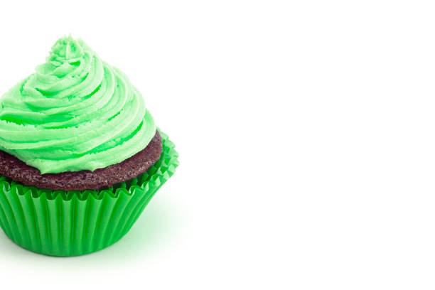 istock Single Green Iced Chocolate Cupcake Isolated on a White Background 1154695353