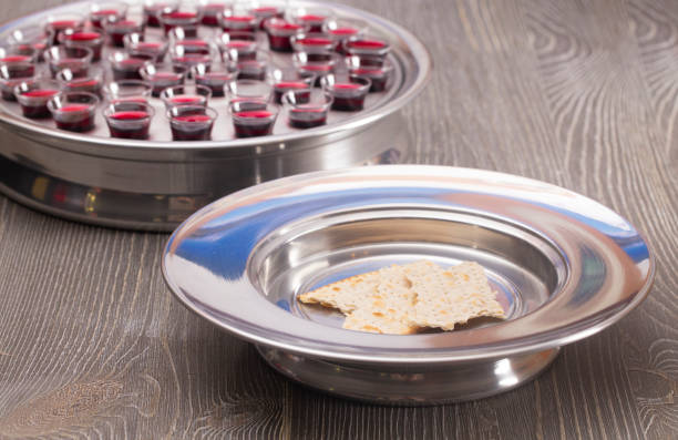 table set for communion or the lords supper a christian remembrance of jesus death - communion table foto e immagini stock