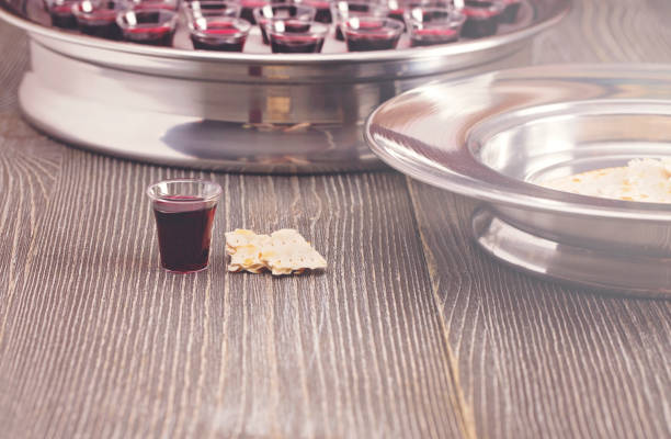 table set for communion or the lords supper a christian remembrance of jesus death - communion table foto e immagini stock