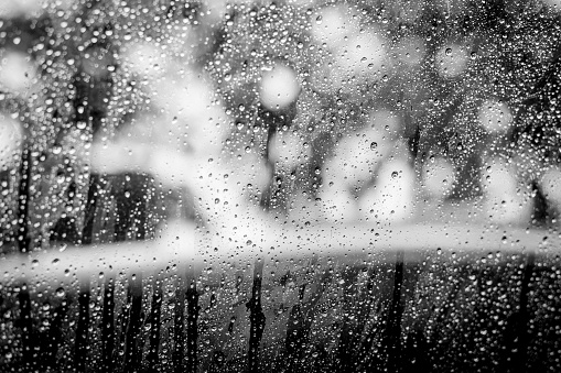 Black and white of Rain drops on car window glass texture background
