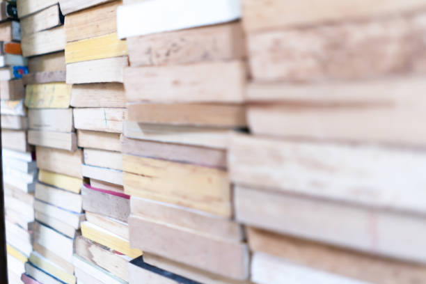 istock Stack books and magazines on table.  Book festival concept. 1154701655