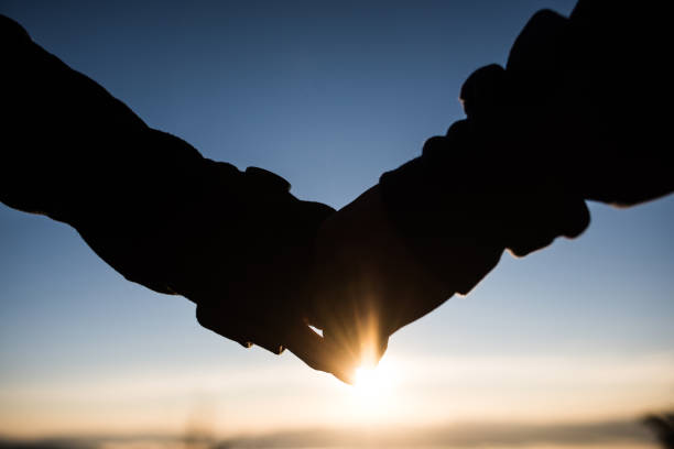istock Couple holding hands with love 1154703093