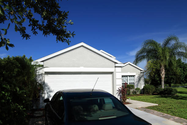 istock Single family home exterior over sunny blue sky 1154703146