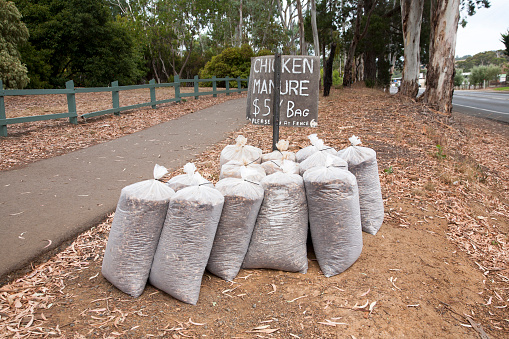 Bags of chicken manure for sale on the side of a country road in South Australia