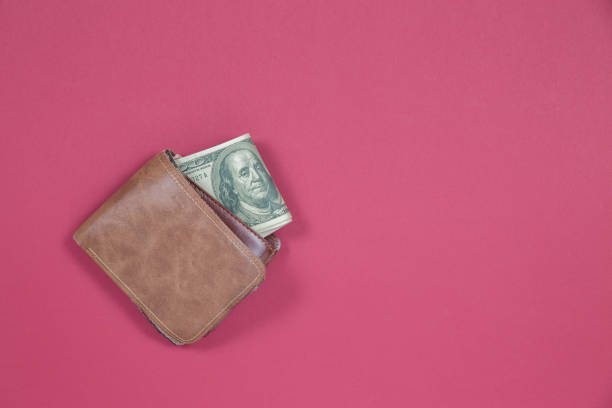 istock Top view wallet and dollar banknote 1154709960