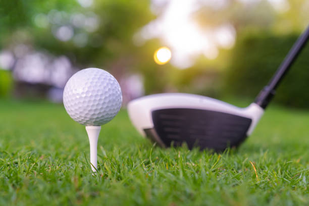 istock Golf ball on green grass ready to be struck on golf course backgroun 1154710864