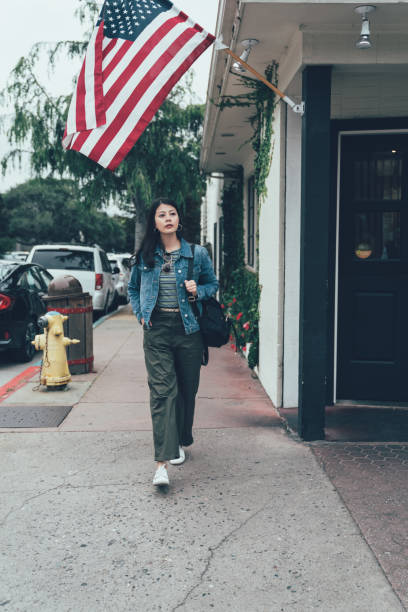 istock woman walking on street with fire hydrant in back 1154710959