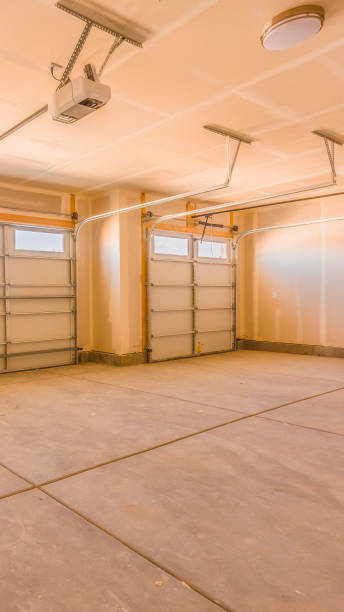 istock Vertical frame Interior of an unfinished garage with unpainted walls and ceiling 1154715028