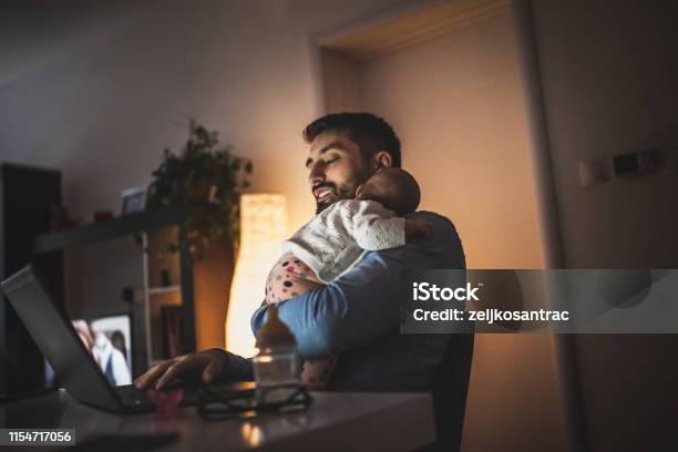 Young Father Working At Home With His Baby Girl Stock Photo - Download Image Now - Father, Working At Home, Baby - Human Age