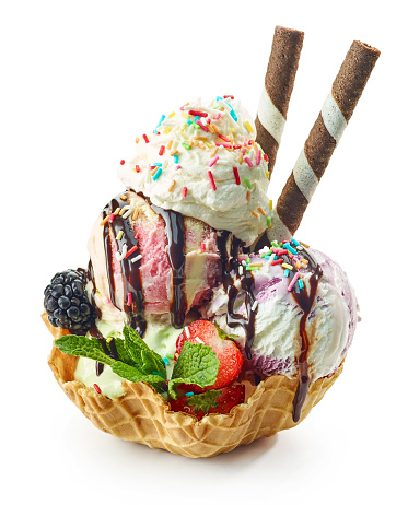 decorated ice cream dessert in waffle basket isolated on white background
