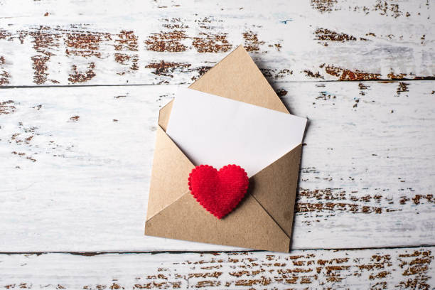 istock Blank Letter on wood background, valentine's day concept 1154718823