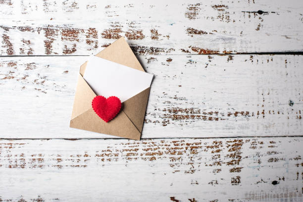 istock Blank Letter on wood background, valentine's day concept 1154719338