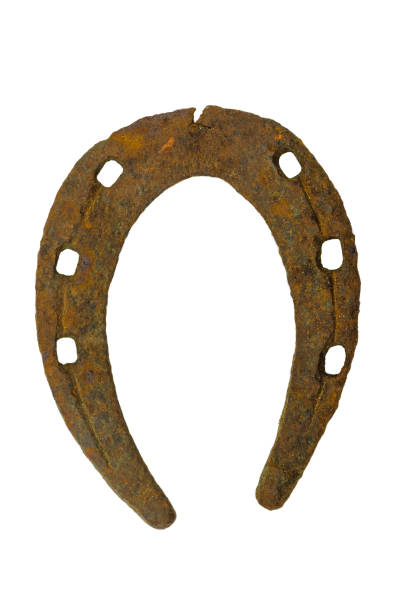 istock Very old and rusty brown horseshoe isolated on white background 1154727274