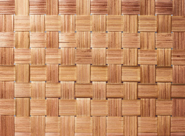 Traditional handcraft weave pattern background. Texture of woven bamboo surface with woven basket. Traditional handcraft weave pattern background. Texture of woven bamboo surface with woven basket. flax weaving stock pictures, royalty-free photos & images