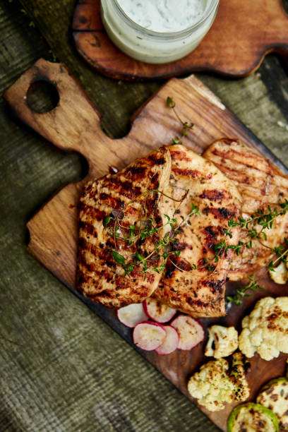 istock Steak turkey grill on wooden cutting board 1154727985