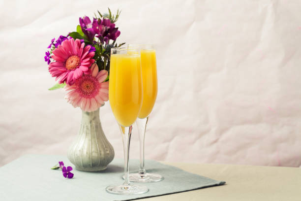 istock Mimosa cocktail and flowers 1154728408