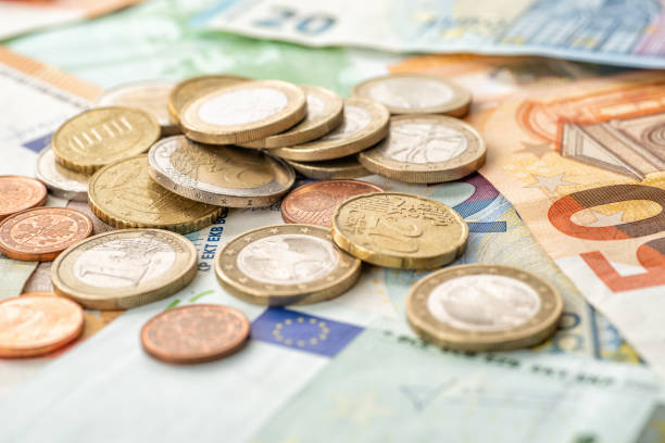 istock Coin money and euro bills 1154728420