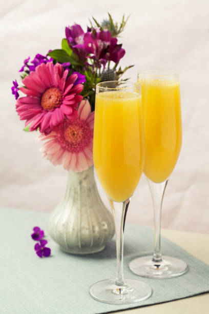 istock Mimosa cocktail and flowers 1154728488